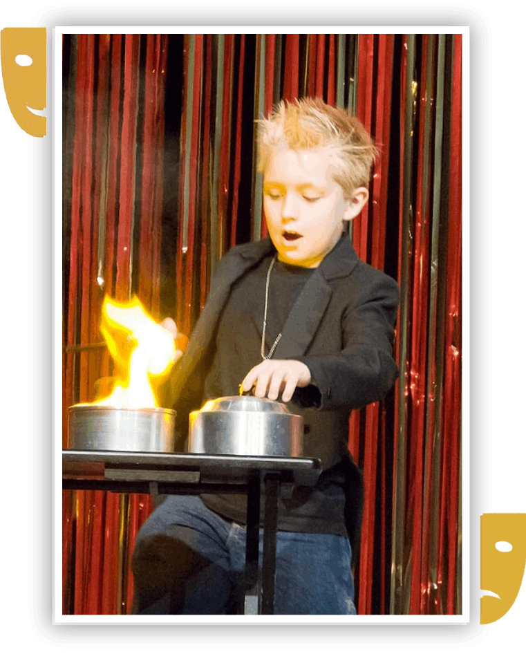 A Boy playing with fire on stage performance